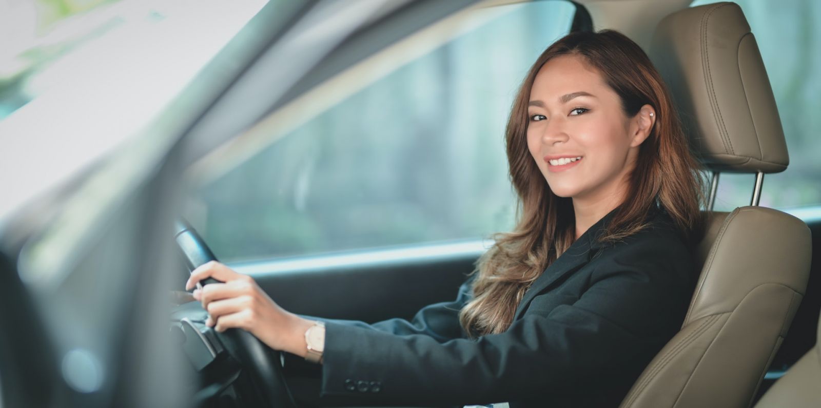 Smiling driver inside the car